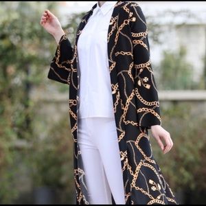 Long sleeved maxi cardigan w/side slits.